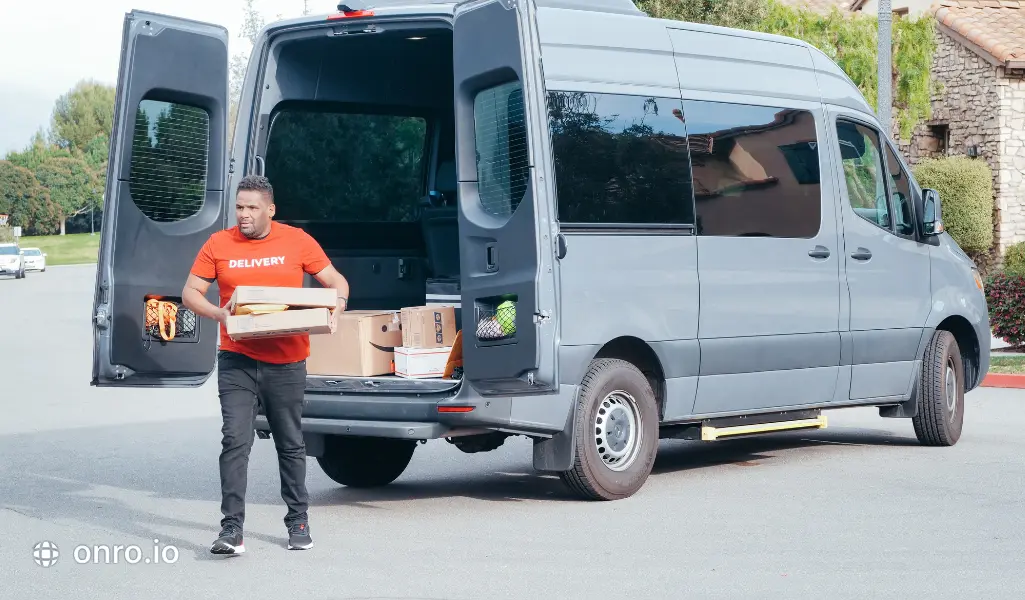 This photo shows a man who is delivering packages as an Amazon delivery partner.