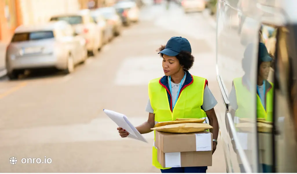 This photo shows a delivery woman who is scheduling deliveries.