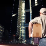 This image shows a man processing the overnight delivery.
