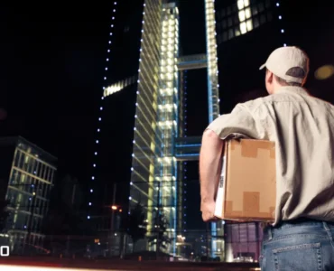 This image shows a man processing the overnight delivery.