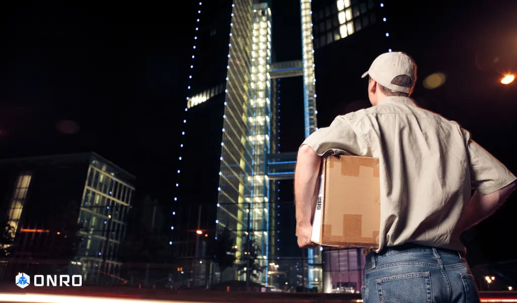 This image shows a man processing the overnight delivery.