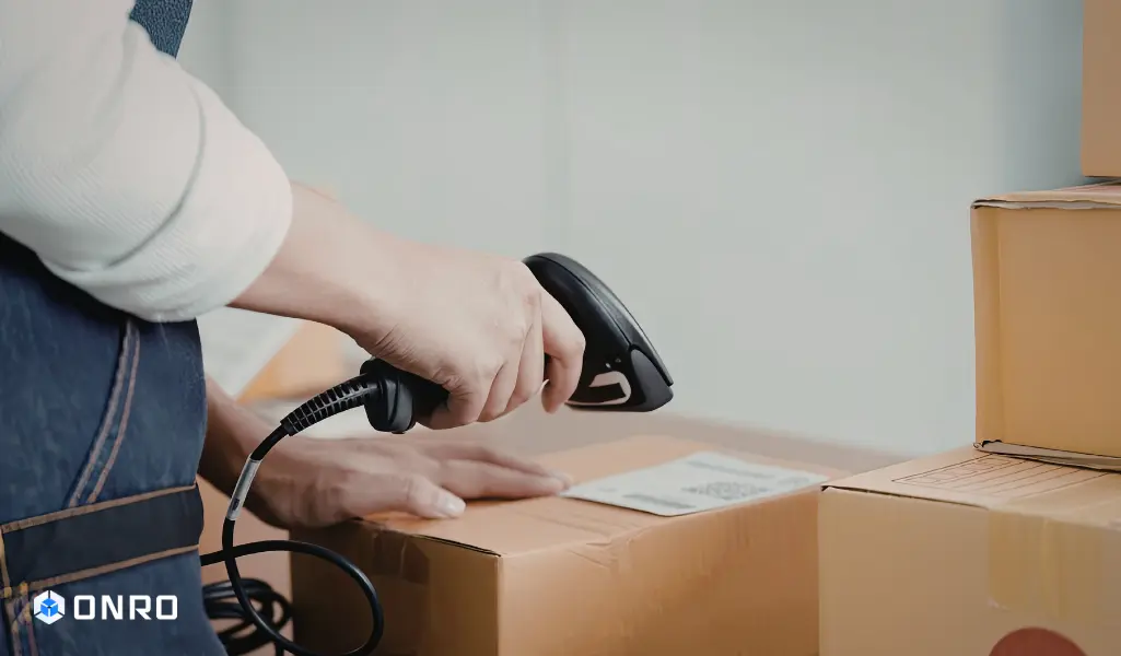 This image shows a same-day or next-day courier who is scanning a barcode.